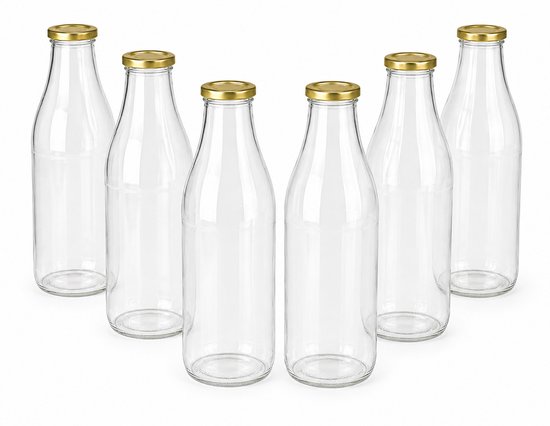 Six bouteilles en verre transparentes vides avec des bouchons dorés, disposées en arc.
