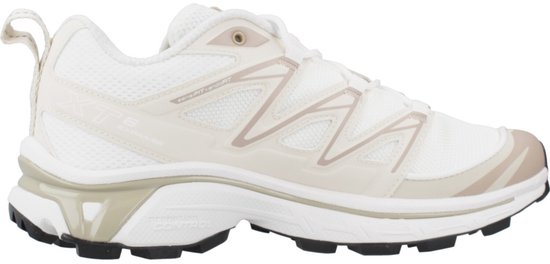 Witte Salomon XT-6 Expanse sneaker met beige lijnen en de tekst 'XT-6 EXPAND' op de zijkant.