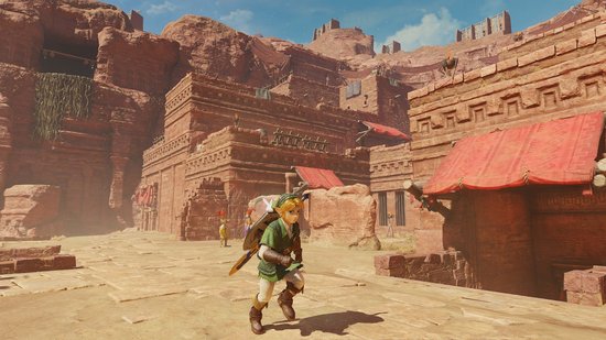Link met groene tuniek loopt door een woestijnstad met rode daken.