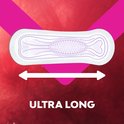 Ultra lang maandverband met paars patroon op een rode achtergrond.