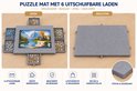Grijze puzzelmat met 6 uitschuifbare lades, twee configuraties: open en gesloten.