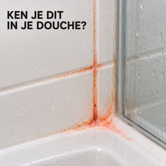 Oranje aanslag in de hoek van een douche.