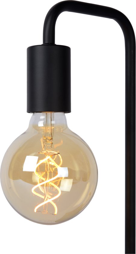 Lampe de table noire avec une grande ampoule Edison ronde avec filament en spirale visible.
