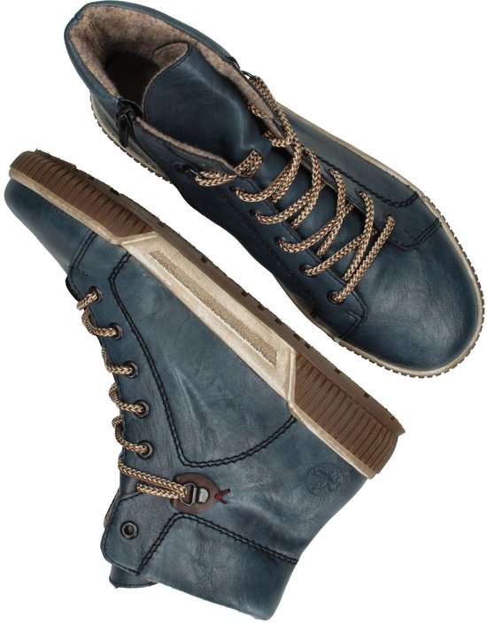 Bovenaanzicht van blauwe veterboots met rits aan de zijkant en bruine zolen.