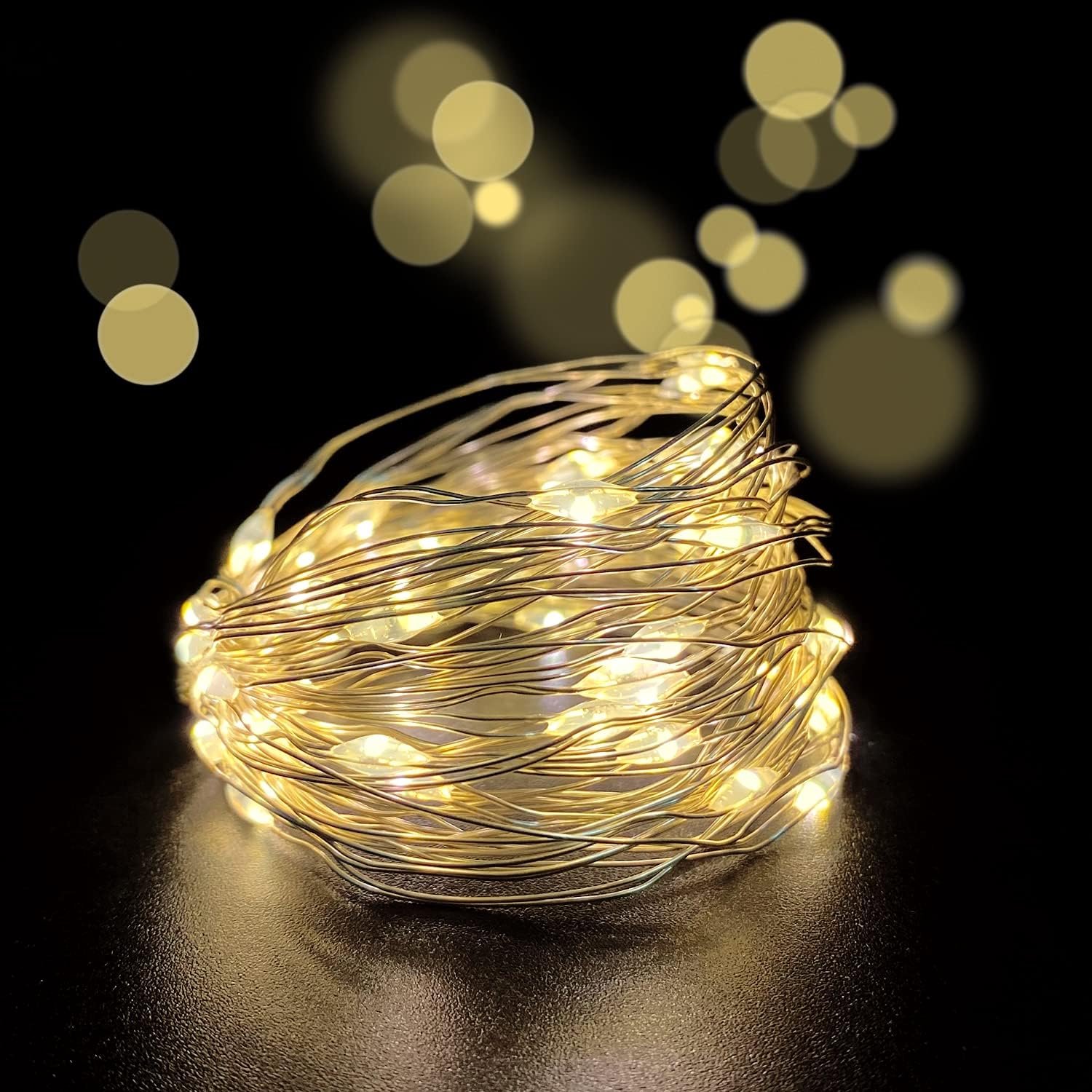 Warmwitte LED-lichtsnoer, 10 m / 100 LED's, USB-voeding, met 8 standen en afstandsbediening; waterdichte koperdraadverlichting voor binnen en buiten, geschikt voor slaapkamer, bruiloft, kerstfeest en tuindecoratie.