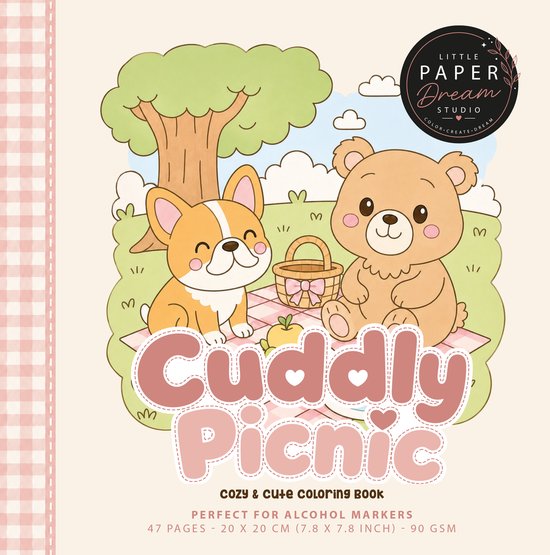 Cover van het 'Cuddly Picnic' kleurboek. Een corgi en een beer zitten op een picknickkleed met een mand en appel.