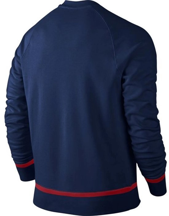 Donkerblauw trainingshirt van FC Barcelona, achterkant, met rode strepen aan de onderkant en mouwen.