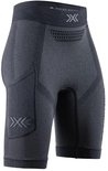 Short noir pour femme avec une poche sur la hanche, logo 'X-Bionic' et structure respirante sur la ceinture.