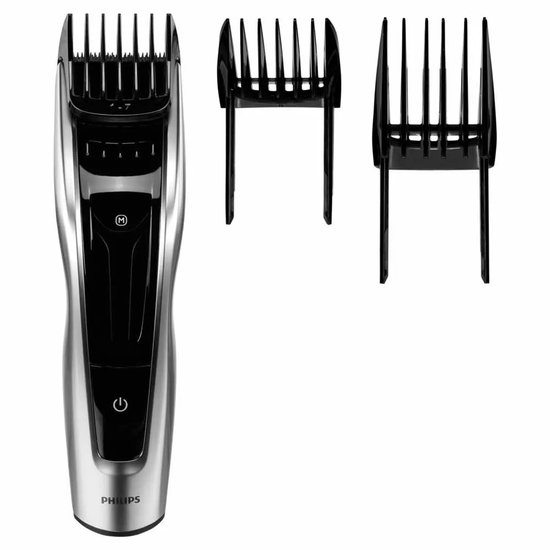 Zilverkleurige Philips tondeuse met zwart detail en twee opzetkammen.