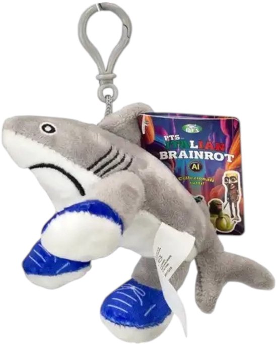 Porte-clés requin en peluche gris avec des baskets bleues. Sur un clip avec une carte Italian Brainrot.