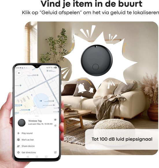 Zwarte Buzzy tracker op een bank, met mobiele telefoon die geluid afspeelt.