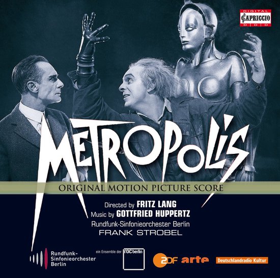 De cover van de Metropolis soundtrack CD. Twee mannen kijken naar een robot. De titel 'Metropolis' staat in grote, witte letters.