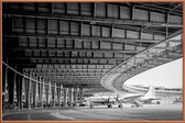 JUNIQE - Poster met kunststof lijst Airplane Hangar -13x18 /Grijs