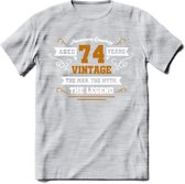 74 Jaar Legend T-Shirt | Goud - Wit | Grappig Verjaardag en Feest Cadeau Shirt | Dames - Heren - Unisex | Tshirt Kleding Kado | - Licht Grijs - Gemaleerd - XL