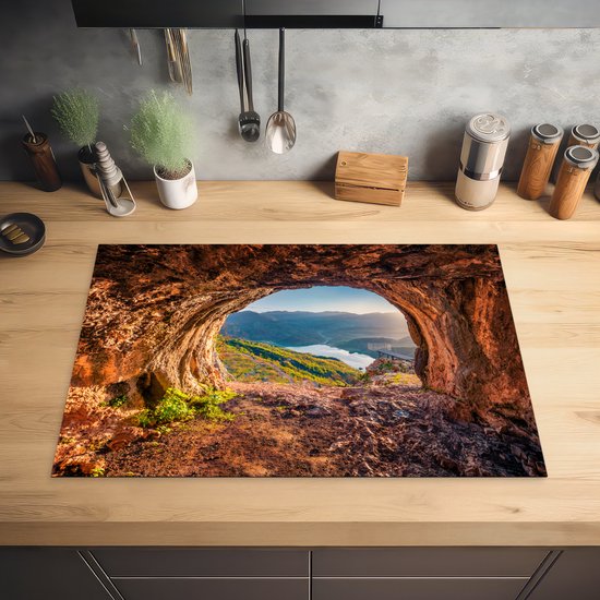 KitchenYeah® Inductie beschermer 78x52 cm - Grot - Berg - Landschap - Natuur - Kookplaataccessoires - Afdekplaat voor kookplaat - Inductiebeschermer - Inductiemat - Inductieplaat mat