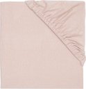 Roze jersey hoeslaken met elastiek, van bovenaf gezien.