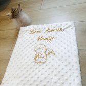 White baby blanket with an angel and dedication embroidered