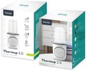Verpakking van de "Thermup 2.0" flesverwarmer van Lionelo. Eén doos toont de functies, de andere de flesverwarmer in een keukenomgeving.
