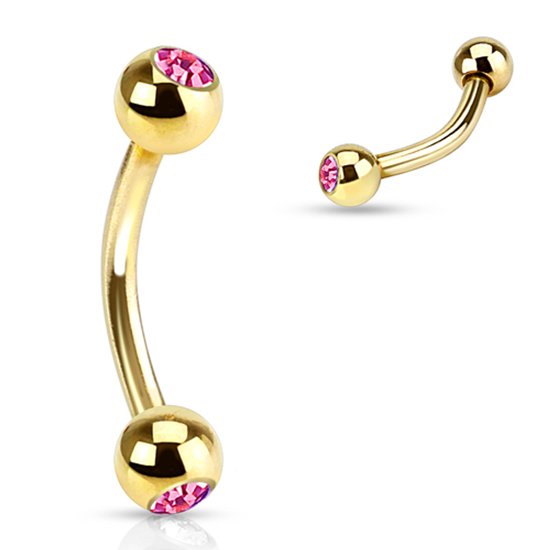 Gouden gebogen barbell piercing met roze steentjes.