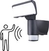 Zwarte buitenlamp met sensor en een pictogram van een persoon die beweegt.
