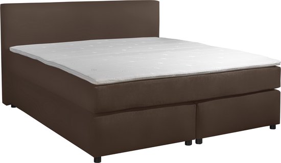 Taupe boxspringbed met matras en twee opbergvakken, op zwarte pootjes.