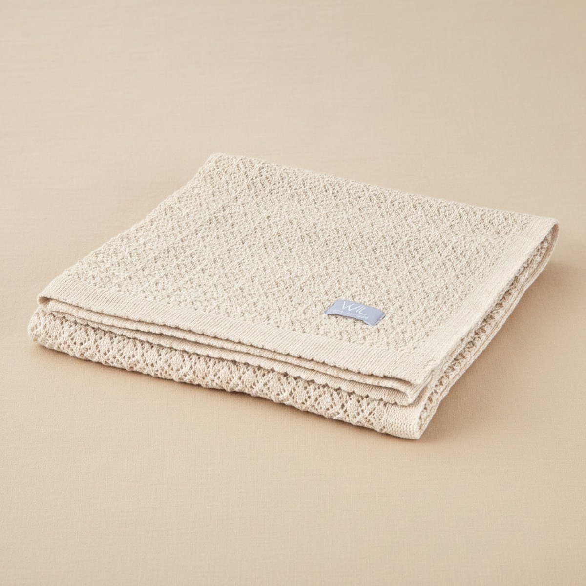 Deken van merino wol met pointelle patroon - beige