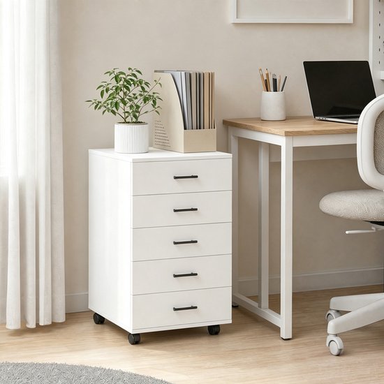 Wit ladenkastje met 5 lades en zwarte handgrepen, naast een bureau met een laptop.