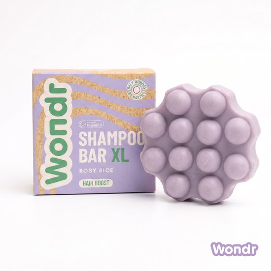Barre de shampoing Wondr XL Rosy Rice de forme violette et à picots, à côté de l'emballage indiquant "Shampoo Bar XL".