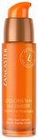 Oranje Lancaster serumfles met gouden dop, 'Golden Tan Maximizer' erop.