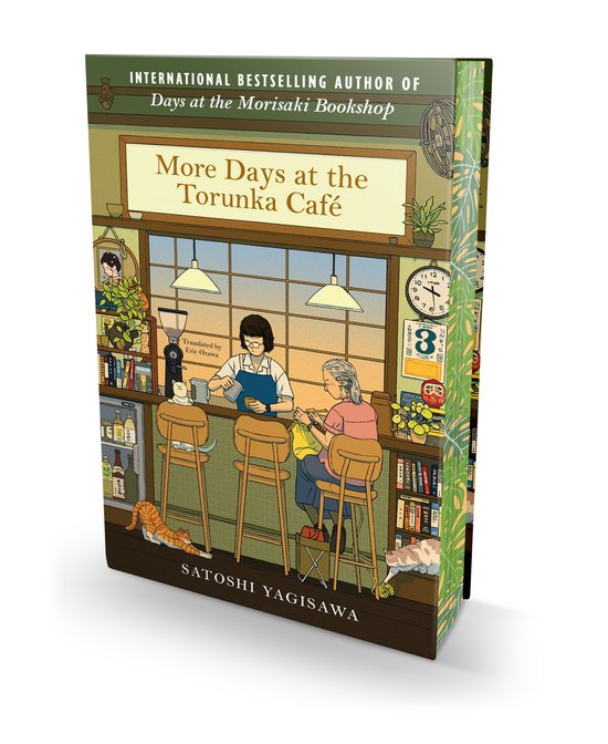 Boek 'More Days at the Torunka Café' met illustratie van een café interieur met bar, klanten en personeel. Titel en auteur zichtbaar.