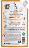 Oranje navulverpakking afwasmiddel met tekst 'Marcel's Green Soap', 'Orange Jasmine' en afbeelding van een wasbeer en sinaasappel. Bevat waarschuwingssymbolen.