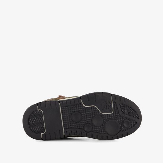 Zool van een hoge sneaker met zwart profiel en witte accenten.
