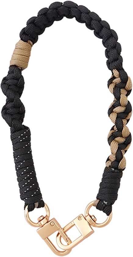 Bracelet tressé noir et beige avec fermoirs mousquetons dorés et dragonne à pois blancs.