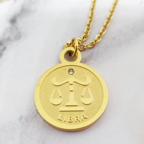 Gouden ketting met de sterren Weegschaal (Libra) en een zirkonia steentje.