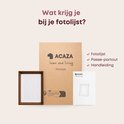 Inhoud van de ACAZA fotolijst: een bruine lijst, passe-partout en handleiding.