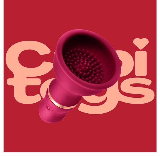 Een roze vibrator met een geribbelde opening en gouden band.