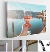 Female hand with glass of wine. Cozy pier on the coast of the lake Tegernsee. Alpine mountains in Bavaria (Bayern) - Modern Art Canvas - Horizontal - 1329176453 - 50*40 Horizontal