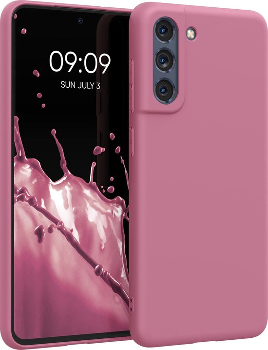 Coque de téléphone rose foncé à côté d'un smartphone.