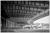 JUNIQE - Poster in kunststof lijst Airplane Hangar -30x45 /Grijs