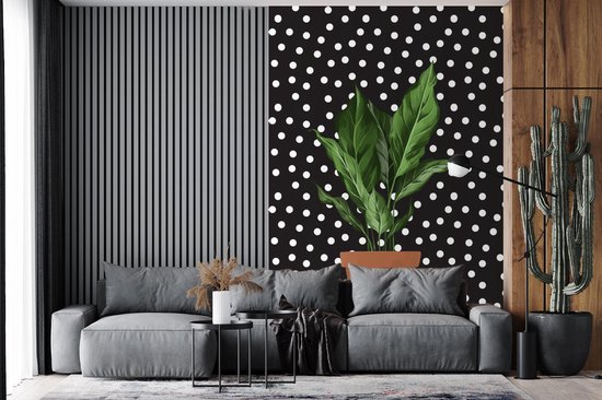 Illustration d'une plant aux feuilles luxuriantes sur fond noir à pois blancs 145x220 cm