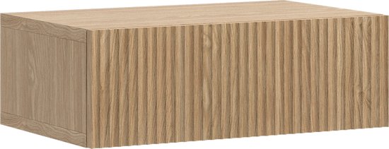 Table de chevet en chêne avec façade rainurée.