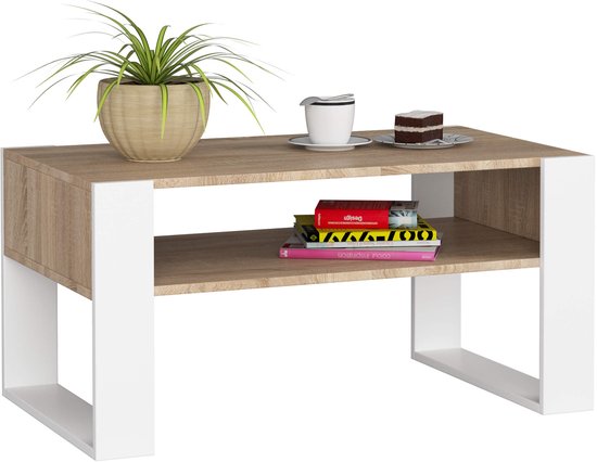 Koffietafel met wit metalen frame en Sonoma eikenhouten blad. Met een open vak, decoratief met plant en boeken.