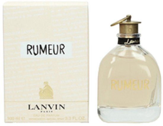 Crèmekleurige verpakking met "RUMEUR" en een glazen parfumflesje met gouden letters "RUMEUR", naast elkaar.