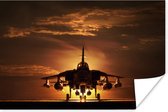 Poster Het silhouet van een straaljager tijdens zonsondergang - 120x80 cm