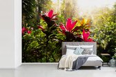 Behang - Fotobehang bloemen middenin de jungle - Breedte 330 cm x hoogte 220 cm