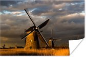 Poster Nuages sombres sur les moulins de Kinderdijk aux Nederland 90x60 cm - Tirage photo sur Poster (décoration murale salon / chambre)