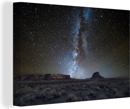 Canvas Schilderij Het Melkwegstelsel boven het Nationaal park Chaco in New Mexico - 140x90 cm - Wanddecoratie