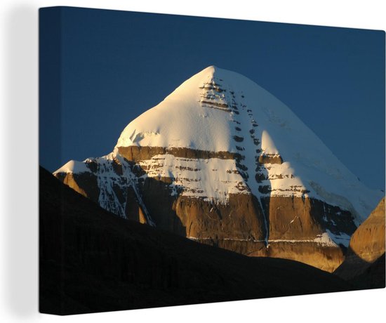 Canvas schilderij 140x90 cm - Wanddecoratie Zonnestralen vallen op de top van de Kailash berg in Tibet - Muurdecoratie woonkamer - Slaapkamer decoratie - Kamer accessoires - Schilderijen