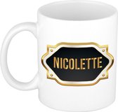 Nicolette naam cadeau mok / beker met gouden embleem - kado verjaardag/ moeder/ pensioen/ geslaagd/ bedankt