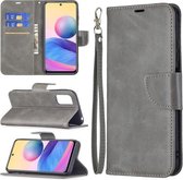 Voor Xiaomi Poco M3 Pro / Redmi Note 10 5G Retro Lamsvacht Textuur Pure Kleur Horizontale Flip PU Lederen Case met Houder & Kaartsleuven & Portemonnee & Lanyard (Grijs)